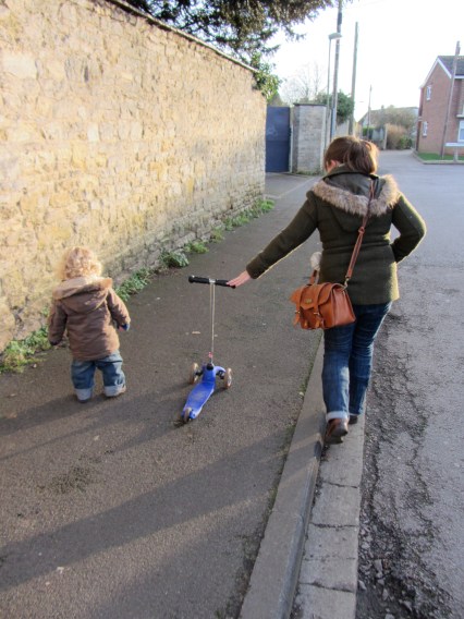 Why ride a scooter when you've got a Mummy to push it along?